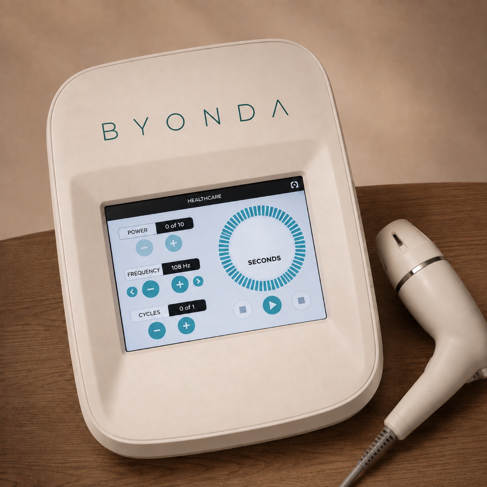 The BYONDA base unit with touchscreen controls and the detachable handpiece